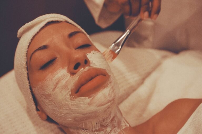 Client receiving a light, refreshing facial treatment at a spa