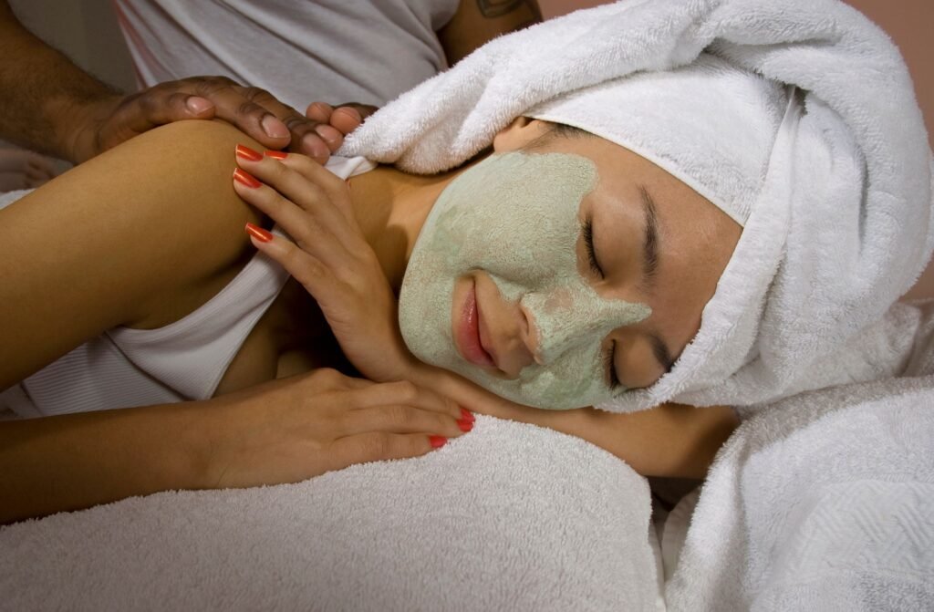 Therapist massaging a client's face during a premium spa facial
