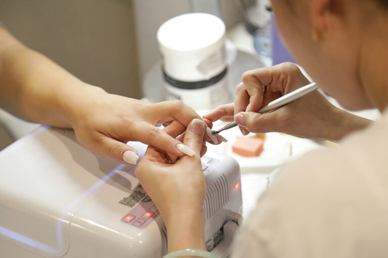 Nail technician giving a client a warm, natural manicure