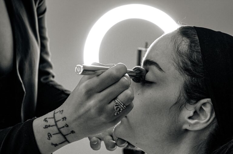 Makeup artist applying event makeup to a client